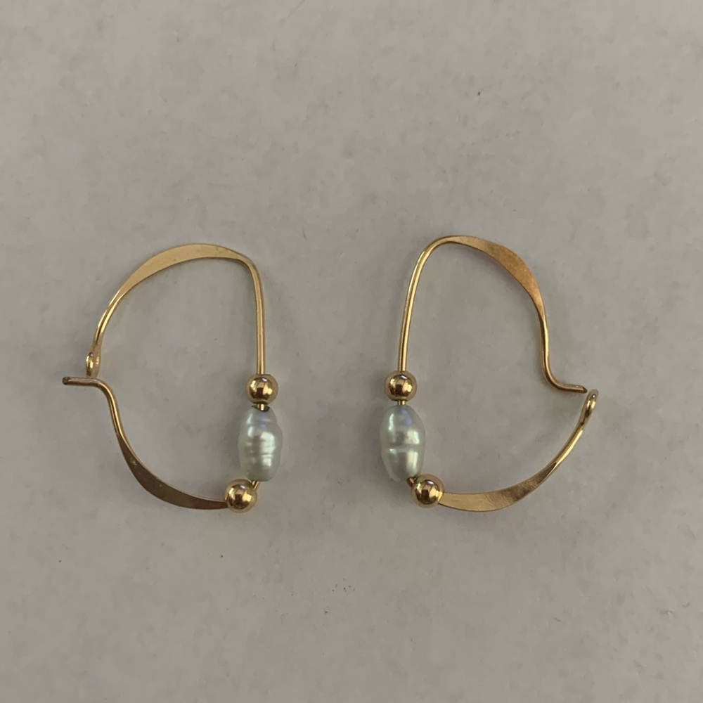 Hand-made small gold hoops with pearl and gold decoration.